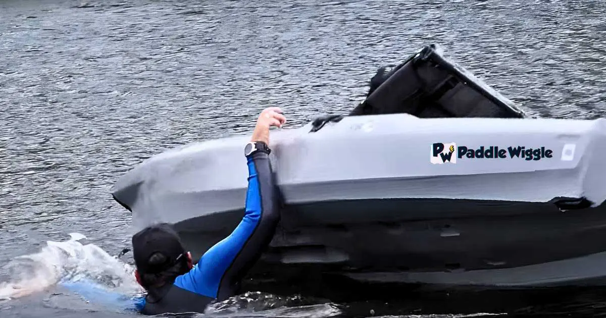 Trying to get back in a kayak after it tip over.