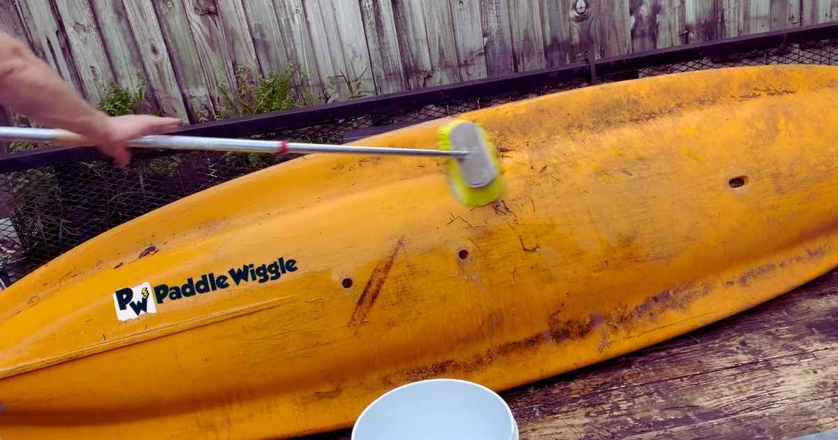 Cleaning a kayak before storing.