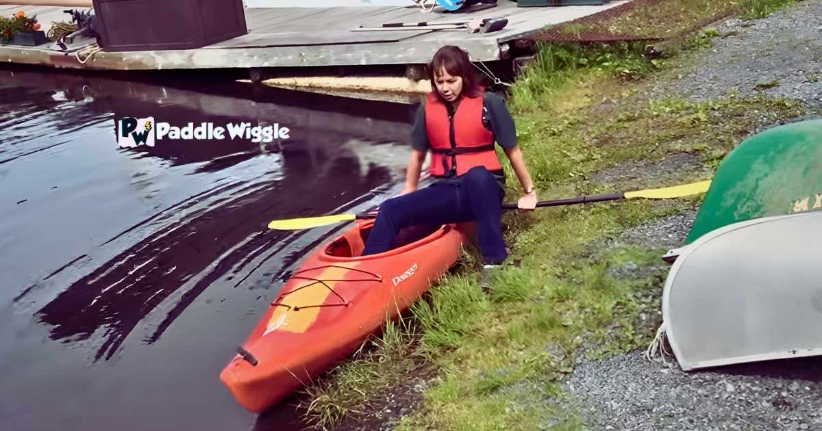 Placing One Leg Outside The Kayak While Keeping The Other Inside.